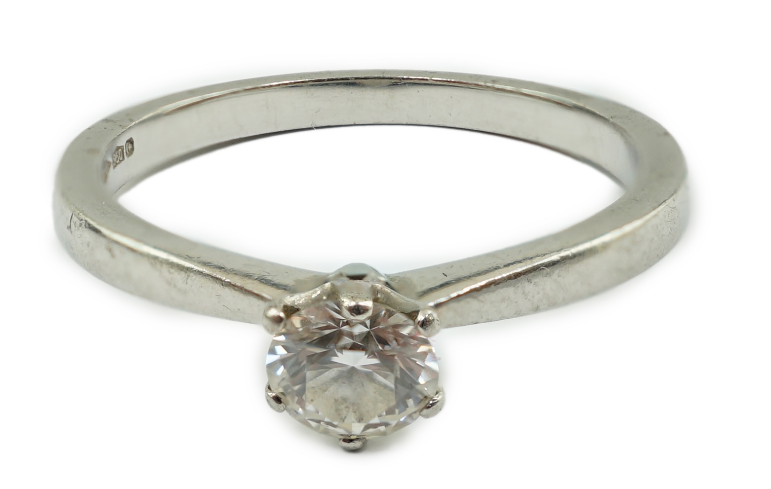 A modern platinum and solitaire diamond set ring